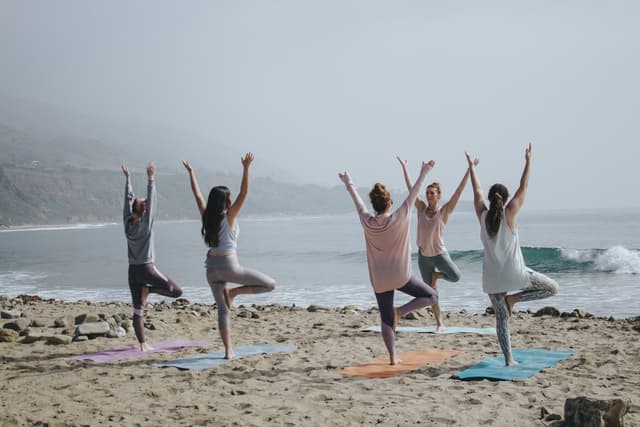 Student holding a standing yoga asana